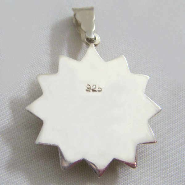 (p1277)Silver pendant motif Sun.